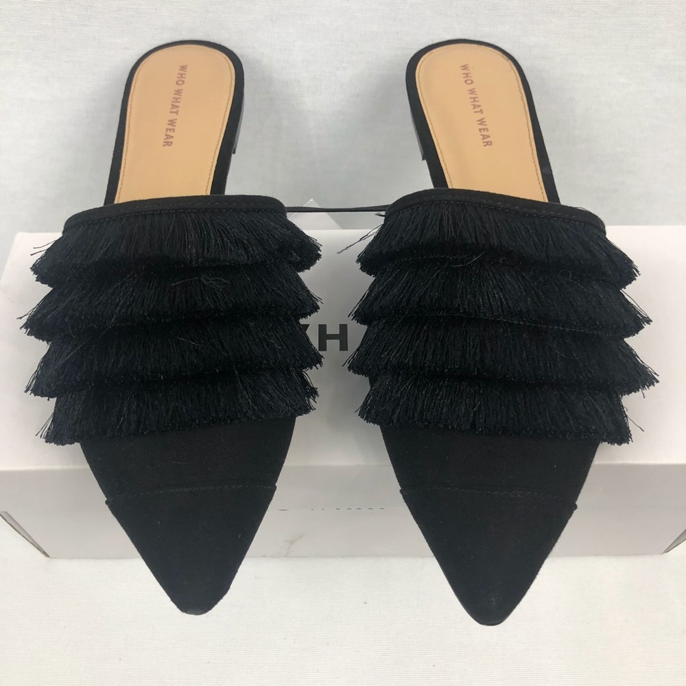Woman’s black tassel pointed slip on mules